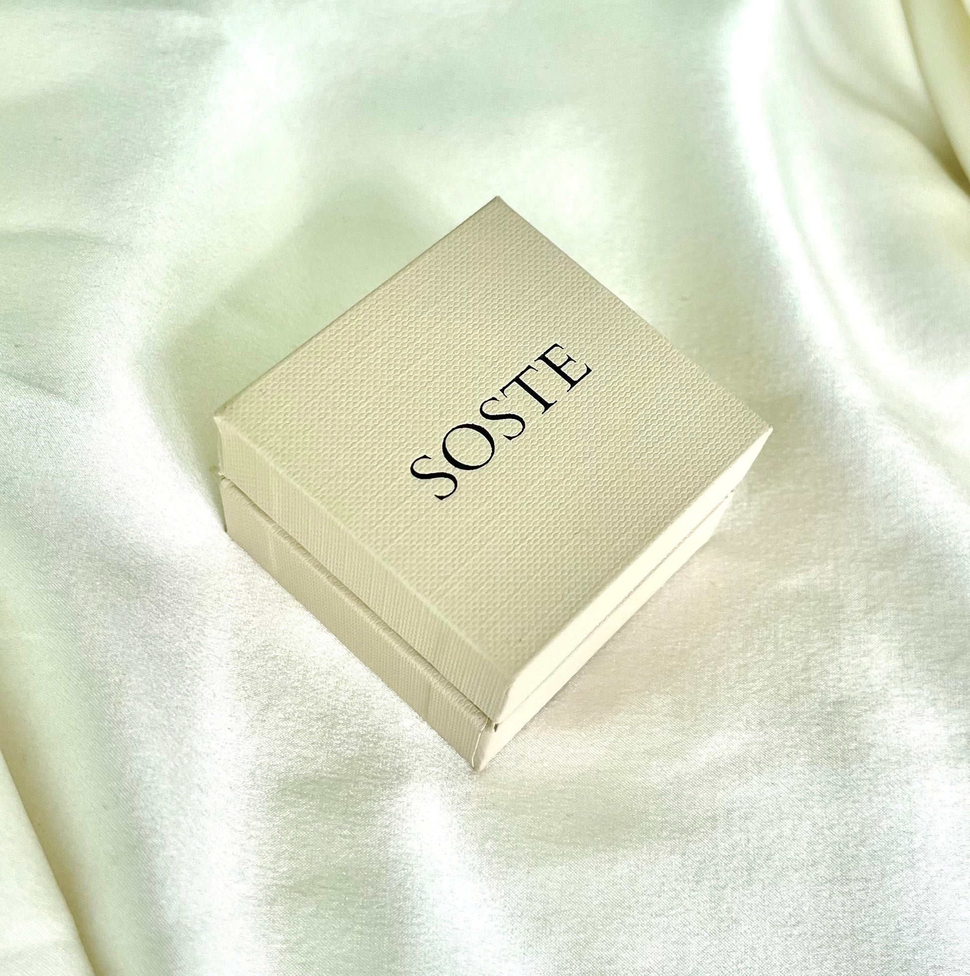 The ring is fully hallmarked and in good condition. This ring is packaged in a Soste hinged ring box.
